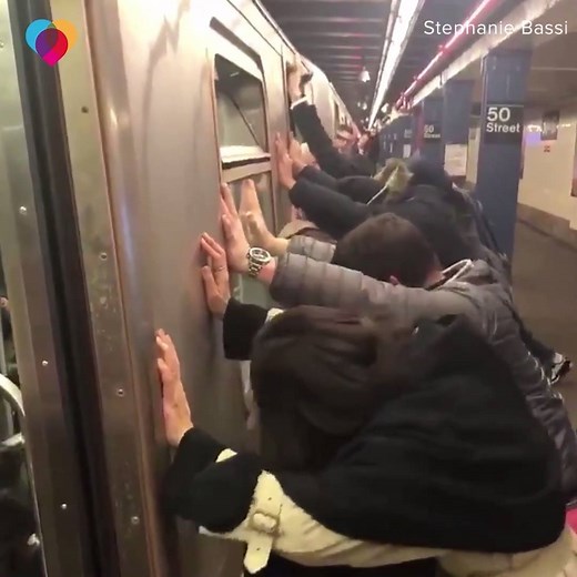 1M views · 1K reactions | KINDNESS OF STRANGERS: When a New York City subway rider’s suitcase got stuck between a car and the platform, several people helped push the car to get it out, cheering and clapping when they did  | The Uplift | Facebook