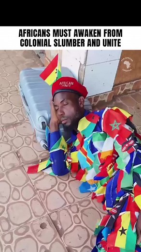 This viral video features a powerful skit by the influential activist and Pan-Africanist, Africa Unite Flagman. Known for his dramatic, satirical approach, he uses this skit to call Africans to action, urging them to awaken from their colonial slumber. In the video, Africa Unite Flagman humorously pretends to sleep, draped in an outfit made of all African flags, symbolizing the collective awakening needed across the continent. Through his bold and creative expression, he sparks a conversation on