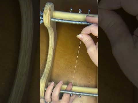 Adding warp thread to an upright bead loom
