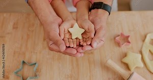 Star, dough and hands baking shape, icon and symbol in a kitchen table or counter while cooking dessert in a home. Child, learning and baker parent help or teaching kid to make cookies as support