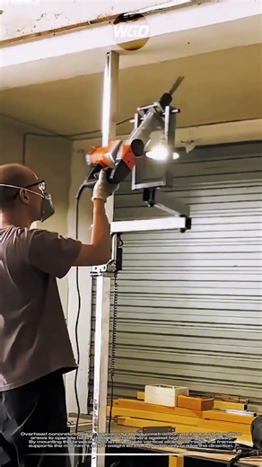 Overhead concrete breaker support rig: Vertical jackhammer assistant for ceiling demolition