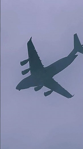 Low flyover before disappearing into the rain