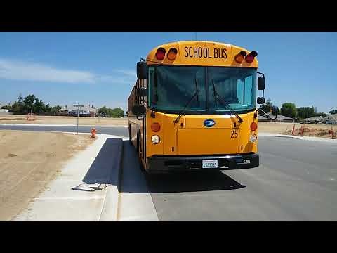 Backing a school bus around a corner. Staying between 8 to 12" from the curb
