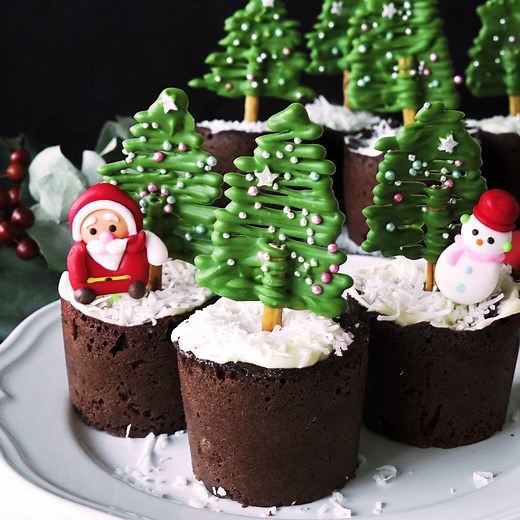 Cream cheese-stuffed muffins topped with matcha chocolate trees will be your new favorite holiday treat. | Tastemade