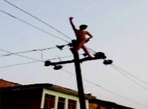 Watch: Drunk man climbs onto high voltage wires | The Times of India