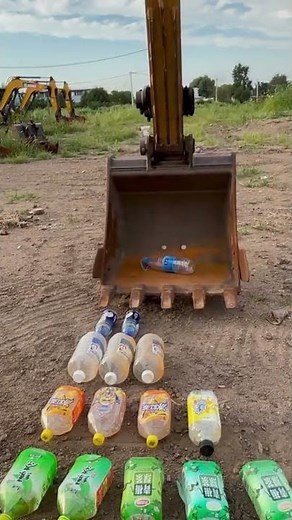 the process of inserting plastic bottles using heavy equipment such as an excavator.
