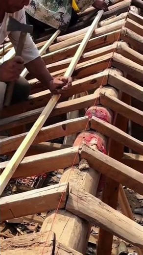 The process of installing a wooden bar to make a roof on a house