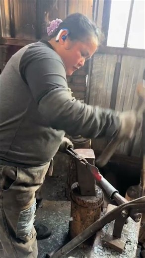 Mastering the Forge: A Woman Blacksmith Crafting High-Quality Metal Tools