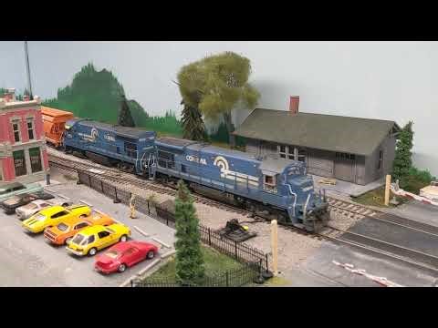 2 Conrail freights run around the layout in HO Scale