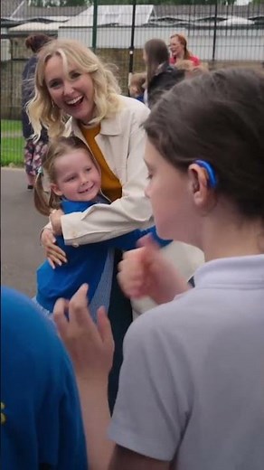 Deaf actress visiting a school for deaf children