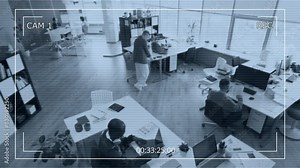 Wide high-angle surveillance camera footage of diverse male and female advertising agency employees working in office - typing on laptops, walking over to colleagues desks and discussing business