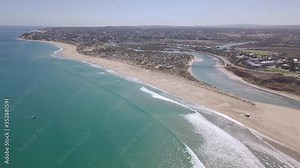 Drone / Aerial shot of the Southern Adelaide Beaches in Summer. The shot is flying over Southport River mouth and Port Noarlunga