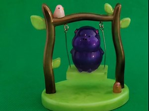 Swinging Pig Figurine