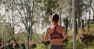 Female turkish runner having a morning jog in garden at dawn, staying fit - healthy lifestyle, everyday life concept slowmotion 4k