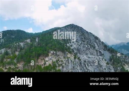 Drone view of mountain slopes with trees and stone cliffs Stock Video Footage - Alamy