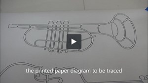 scroll saw pattern of a trumpet digitized and cut on a CO2 laser