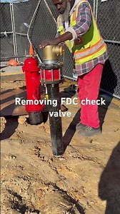 Removing check valve to observe Fire Department connection flow testing in the field