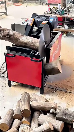 Cutting the wooden logs with a large circular saw machine for a professional and artisan wood work