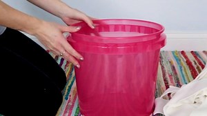 Grab a bucket and a rug to make this storage ottoman. | DIY with Hometalk