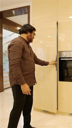 Kitchen CONCEALED FRIDGE in Mega Marble House by Ansari Architects