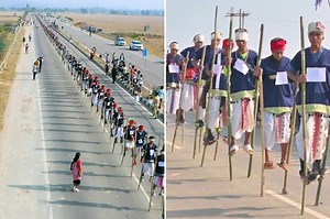 Over 700 people walks on stilts together to break world record