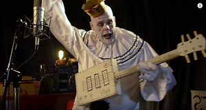 Sad 7‑Foot Tall Clown Sings “Pinball Wizard” in the Style of Johnny Cash, and Other Hits by Roy Orbison, Cheap Trick & More