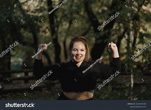 Happy Young Woman Flexing Muscles Dark Stock Photo 2225137283 | Shutterstock