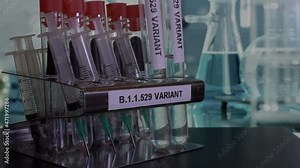 Close up shot of Omicron B.1.1.529 laboratory samples being placed into a rack, the new deadly variant of Covid 19 identified in South Africa
