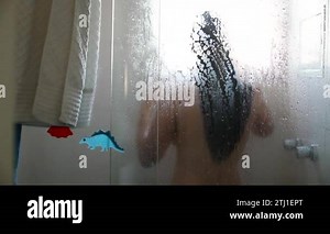 Woman taking shower, casual candid person showering and washing seen through window Stock Video Footage - Alamy
