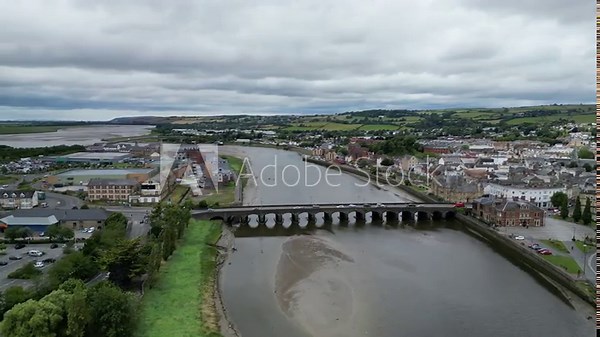 Barnstaple, Devon, England: DRONE VIEWS: Long Bridge spanning the River Taw in central Barnstaple. The medieval bridge reflects the town's early history as a prosperous wool trading centre (Clip 4).