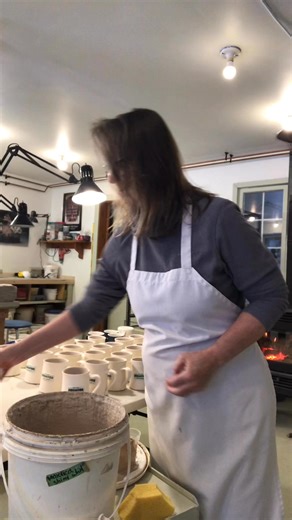 A few years ago on a winter day, glazing mugs. | Anne Chambers Pottery