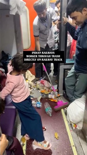Indian railway worker through trash directly to track #indianrailways #indianrailway