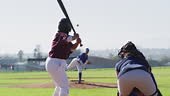 Diverse group of female baseball players playing on the field, hitter...