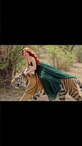 a girl riding on a tiger