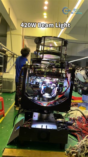 420W Beam Light – Ultra-Sharp 0–2° Parallel Beam A detailed production look at the 420W Beam Light, equipped with a powerful 421W Osram lamp and delivering an ultra-tight 0–2° parallel beam with stunning brightness up to 21,000 lumens. Featuring 14 colors, 13 gobos (10 fixed 3 flowing), dual prisms (8F 24F) with bi-direction rotation and overlay, plus independent frost for enhanced beam texture. Smooth 540° pan / 270° tilt, 14/17CH control, and built-in effects allow flexible programming for con