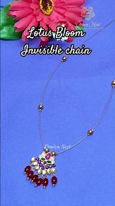 "Lotus bloom 💫✨ Elevate your style with this delicate pendant on an invisible chain #shortsfeed#diy