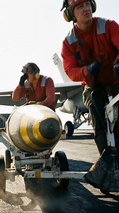 For the US Navy, preparing an F/A-18 Super Hornet for combat means grappling with tons of metal, sweat, and adrenaline. This isn't just a picture of sailors moving a weapon; it's a raw glimpse into the heavy, manual effort behind striking power. Seeing the intense commitment required just to haul this GBU-31 JDAM into position, what do you think is the single most critical job on the carrier deck? 🇺🇸 . . #military #usa #NavyLife #Aviation #GBU31 #SuperHornet #MilitaryLogistics #FlightDeck | Mi
