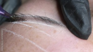 close-up video reveals the precision of the microblading needle, delicately crafting each hair stroke. Witness the transformation of sparse brows into fuller. microblading or eyebrow tattooing