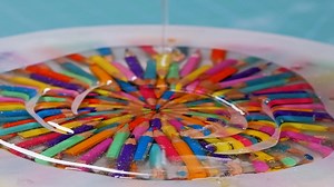 Cool resin clock with coloured pencils