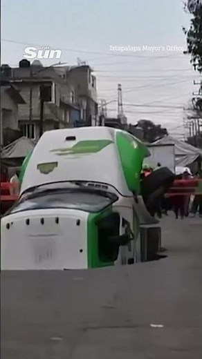Moment truck falls down giant sinkhole in Mexico City