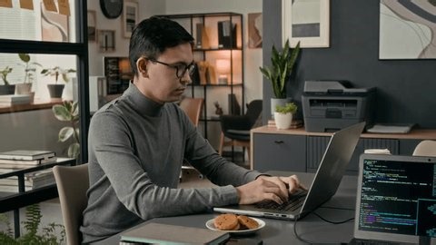 clip-4012012755-portrait-smiling-gen-z-web-developer-programming