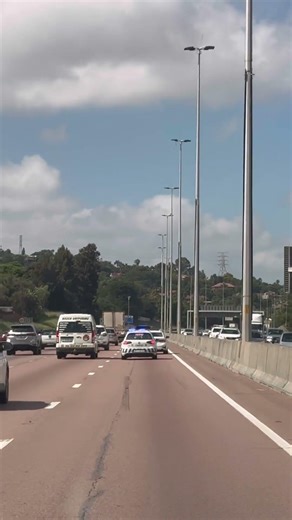 Blue Lights Above The Law ? White BMW KC10VDGP With Windshield Blue Light Flashing And Escorted.