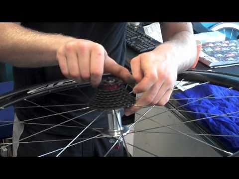 Changing cassette or cogs on rear wheel of bike