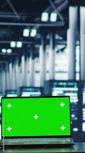 Vertical video Trained computer scientists looking around high tech data center, using mockup laptop to crosscheck disaster recovery plan and assess server systems in need of replacement, preventing