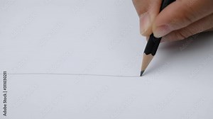 Artists hands drawing a flat line with a black pencil on paper.