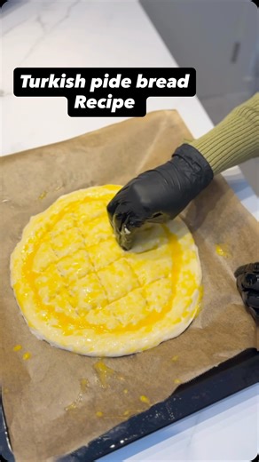 Shuna's Kitchen on Instagram: "Soft Turkish Pide Bread. Nothing beats warm, fresh bread straight from the oven. This Turkish pita is soft, fluffy, and full of comforting aroma, perfect for breakfast, lunch, or just a cozy snack. You’ll need: • 2 cups white bread flour • A pinch of salt • ¾ cup warm water • ¼ cup buttermilk (or milk) • 1 tsp sugar • 1 tbsp yeast • 2–3 tbsp oil or melted butter Topping: • 2 egg yolks • Sesame seeds & black seeds How to make it: 1. Mix flour and salt. In another bo