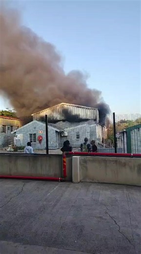 Durban firefighters brought a blaze under control after it tore through a warehouse on Cypress Drive in Glen Anil on Friday. The contents of the building remain unclear, but the fire engulfed the premises before crews managed to extinguish it. 📷: Durban Fire Operations #DurbanFire #FirefightersBattle #BuildingBlaze #WarehouseInferno