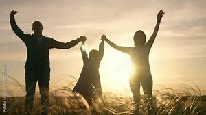 teamwork. team happy family community holding hands together silhouette at sunset unity. group of people hands. teamwork happy family is performing raise fun your hands. teamwork partnership business