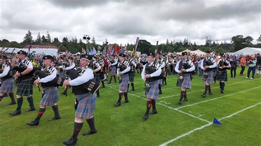 The opening march of the 2024 Inverness Highland Games at Bught Park in Inverness on Saturday 13th July 2024. The parade was led by the combined City of Inverness Pipe Band and Forres and District Pipe Band, followed by the Clan societies with their standard bearers and members of Ssafa. The bands were playing Farewell to the Creeks and Leaving Port Askaig. Thousands of locals and visitors from all over the world gathered at Bught Park for the 2024 Inverness Highland Games, which were opened by 
