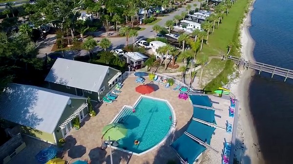 You Need to Be Here! Navarre Beach, Florida: it’s known for natural beauty and a laid back attitude – the perfect place for an Upscale Waterfront RV Resort in a lush tropical setting. Santa Rosa RV Resort is just minutes away from pristine sugar white sandy beaches along the Gulf of Mexico. Call 850-936-4791 to book your Rv Site. #navarrebeach #rv #rvlife #rvtravel #beach #beachlife | Santa Rosa RV Resort